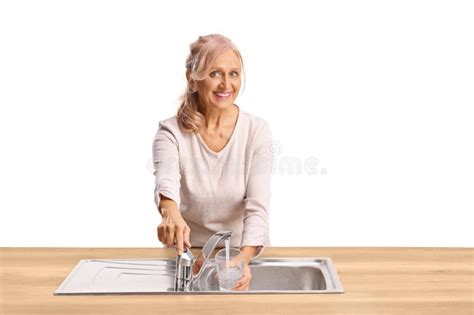 Woman Pouring A Glass Of Water And Smiling Stock Image Image Of Hydration Mature