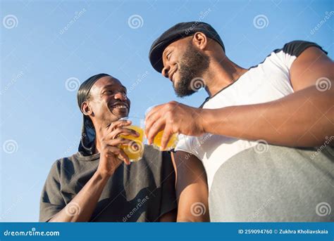 Close Up Of African American Gay Men On Blue Sky Background Stock Photo Image Of Loving Fruit