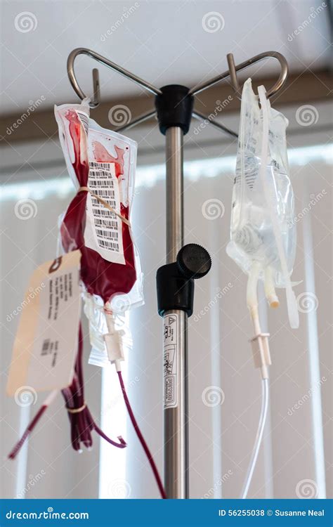 Iv Pole With Saline And Fluids In Medical Setting Stock Photo Image