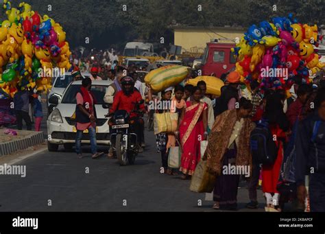 Indian Devotees Return After Taking A Holy Dip In Saryu River On The