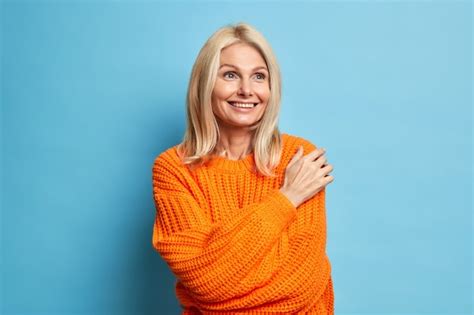 Free Photo Satisfied Blonde Middle Aged Woman Has Dreamy Expression