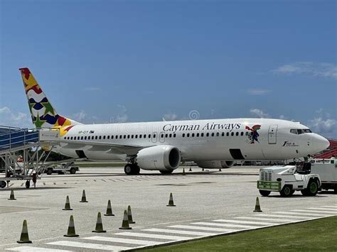 Cayman Airways Airplane At The Owen Roberts International Airport On