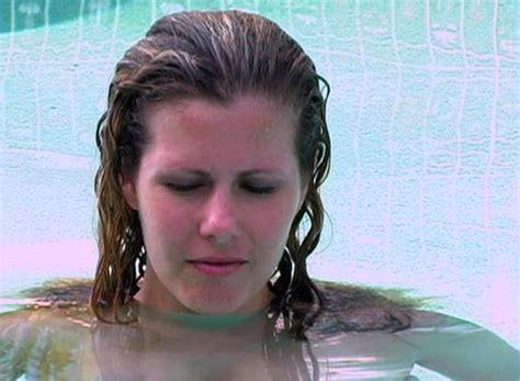 Bikini Clad Blonde Dives Into A Swimming Pool Stock Video Footage