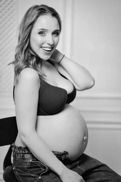 A Sexy Beautiful Naked Pregnant Woman Kneeling On The Bed Stock Photo Sayfutdinov