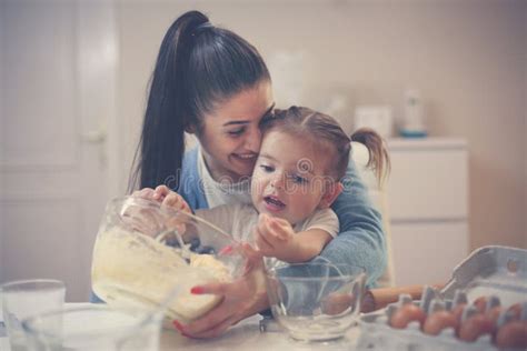 Mother And Daughter Baking Cookie And Mixing Dough Stock Image Image