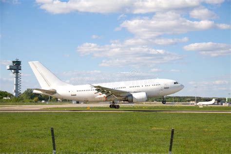 Airplane Landing On Runway Stock Photography - Image: 30495322