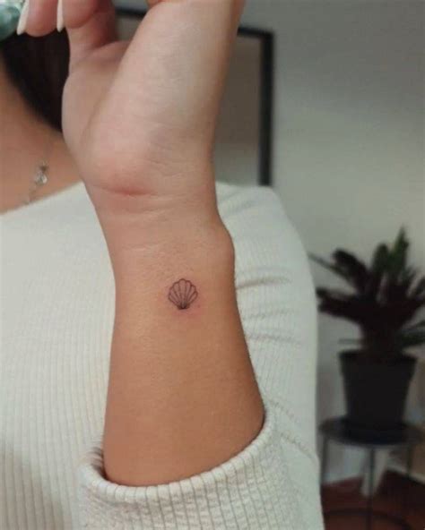 Minimalist Seashell Tattoo On The Wrist