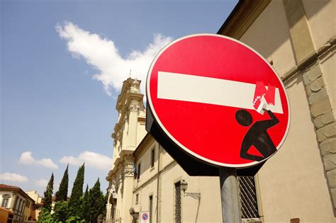 Street art in Florence: look at the traffic signs! - Act of Traveling