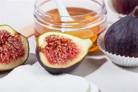 Premium Photo Fresh Fig Fruits Honey And Yogurt Close Up