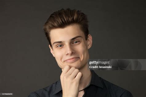 studio portrait   attractive  year  man   gray shirt