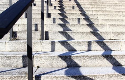 Premium Photo Stairs And Shadows In Bright Sunlight