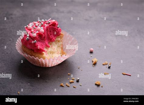 Failed Cupcake With Cream On Grey Table Troubles Happen Stock Photo