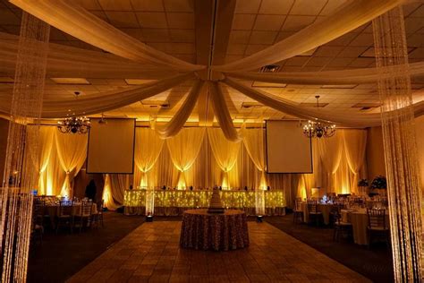 Gorgeous Wedding Reception Featuring Ceiling Draping Crystal Columns