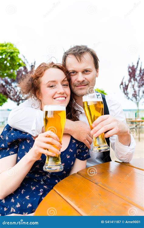 Man and Woman Drinking in Beer Garden Pub Stock Image - Image of people ...