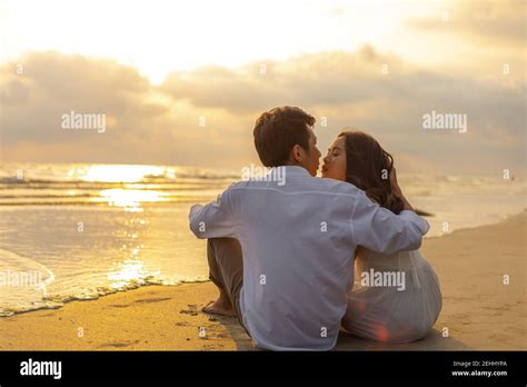 Couple In Love Watching Sunset Together On The Beach Travel Summer Holidays People Romance