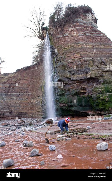 Waterfall at seaside beach Doniford Bay Stock Photo - Alamy