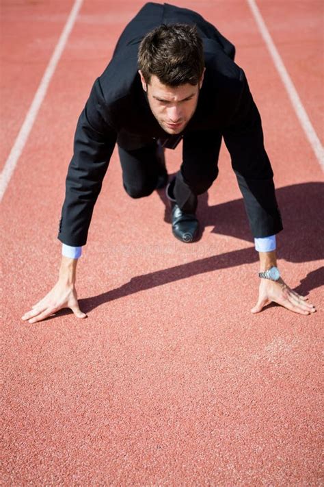 Businessman Ready To Run Stock Photo Image Of Focused