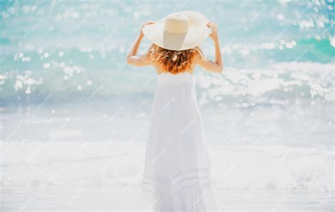 Premium Photo Back View Beautiful Girl With Straw Hat Enjoying