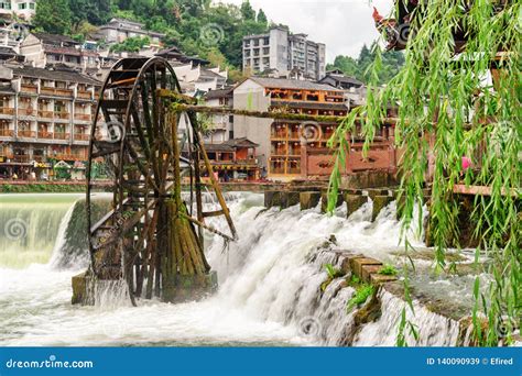 View Of Water Wheel And Scenic Waterfall Phoenix Ancient Town Stock