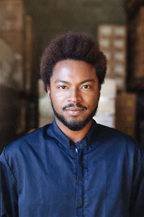 Portrait Of A Young African American Male Worker In A Warehouse By