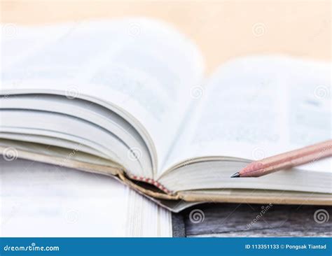 Open Textbook Stacked On The Wooden Table Selective Focus Stock Image