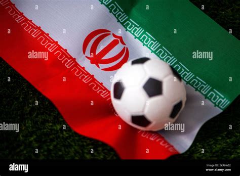 Iran National Football Team National Flag On Green Grass And Soccer