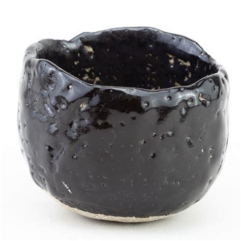 Akiko Hirai A Stoneware Chawan Covered In Pitted Black Glaze MutualArt