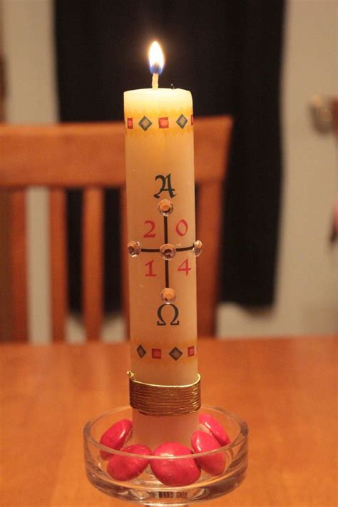 The Paschal Candle Is A Symbol Of Baptism A Small Candle Becomes Lit By This Symbol And