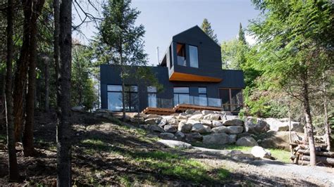 Black Quebec Chalet By Atelier Boom Town Overlooks Forest And Lake