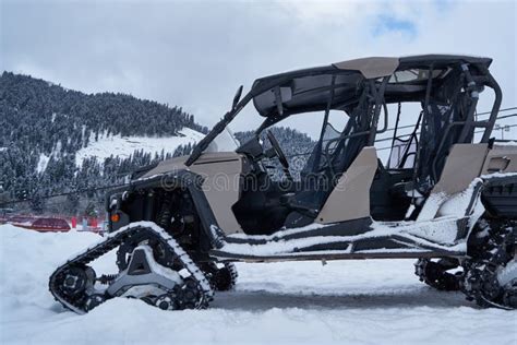 ATV with a tracked system stock image. Image of road - 233830787