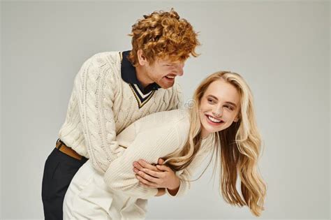 Cheerful Redhead Man Hugging Excited Blonde Stock Photo Image Of Confident Elite 308188840