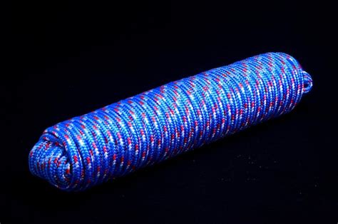 Premium Photo Twisted Roll Of Rope On A Black Background