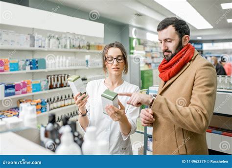 Pharmacist With Client In The Pharmacy Store Stock Image Image Of