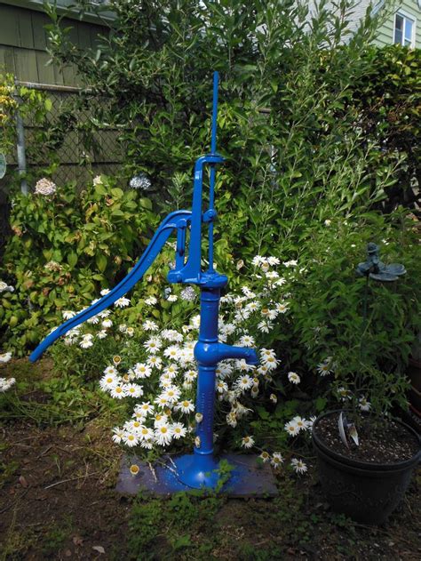 I Spray Painted This Rusty Antique Water Pump To Brighten My Garden