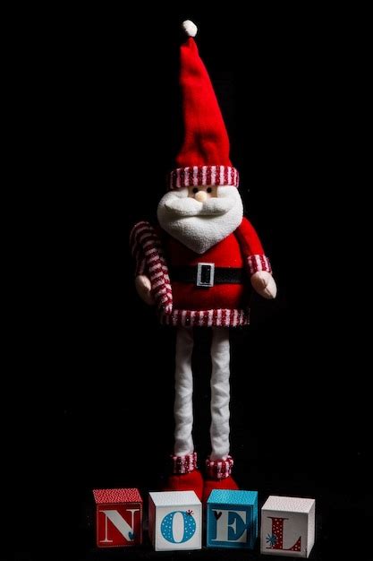 Premium Photo Close Up Of Santa Clause Stuffed Toy Against Black