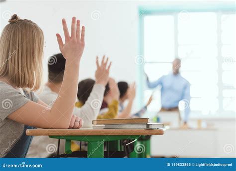 High School Students Raising Hands To Answer Stock Image Image Of