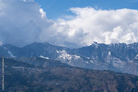 White Clouds Above The Snow Covered Mountains Of Kullu Valley As Seen