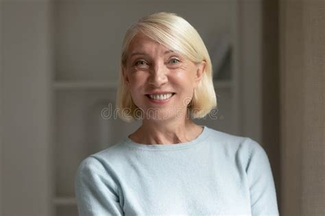 Head Shot Portrait Mature Woman With Healthy Toothy Smile Stock Photo
