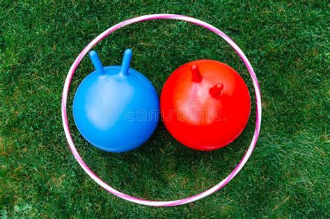 Bouncing Balls Or Hoppers And Hula Hoop On Grass Stock Image Image Of