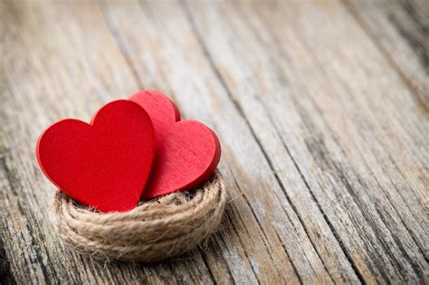 Premium Photo Red Heart Shaped On A Wooden