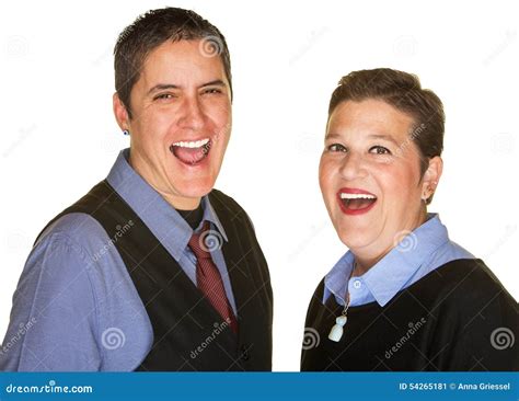 Laughing Lesbian Couple Dancing Playfully On A Beach At Sunset Royalty Free Stock Photography