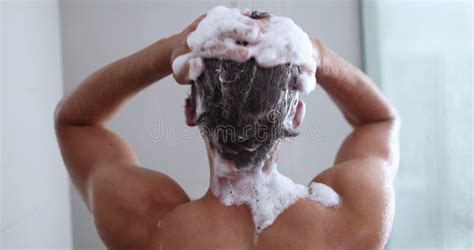 Man Taking A Shower Washing Hair With Shampoo Product Under Water