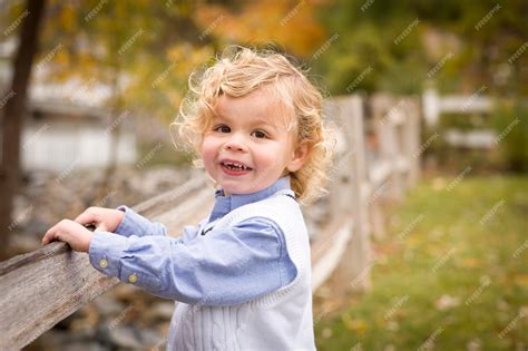 Premium Photo Happy Adorable Young Blonde Boy Playing Outside