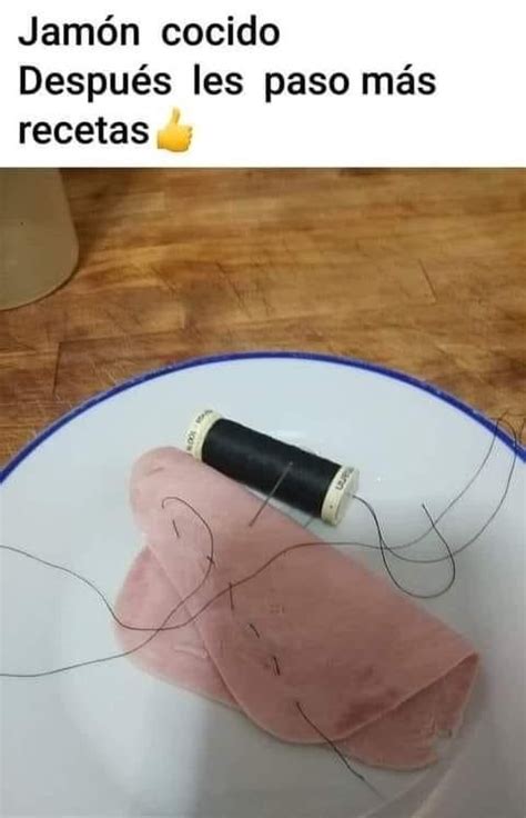 A Piece Of Ham On A Plate With A Knife And Thread In It That Says