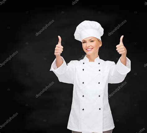 Smiling Female Chef Showing Thumbs Up Stock Photo Syda Productions