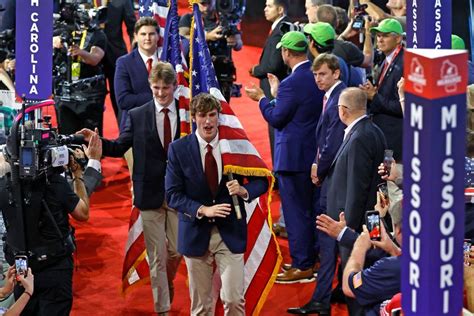 Fraternity Brothers March Flags Through Convention