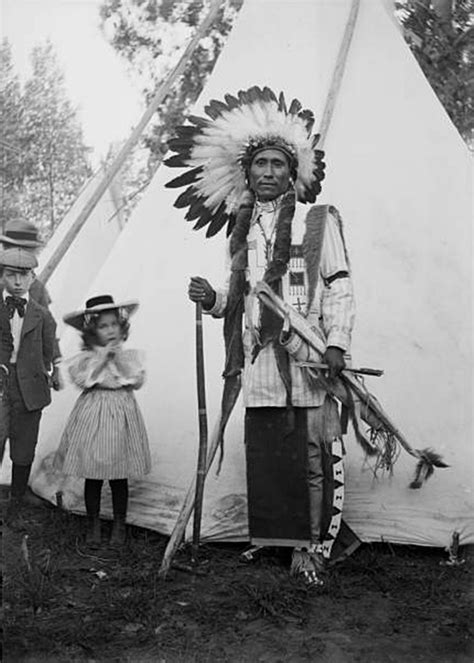 A Native American Arapaho Man Poses With A Bow Arrows And Quiver