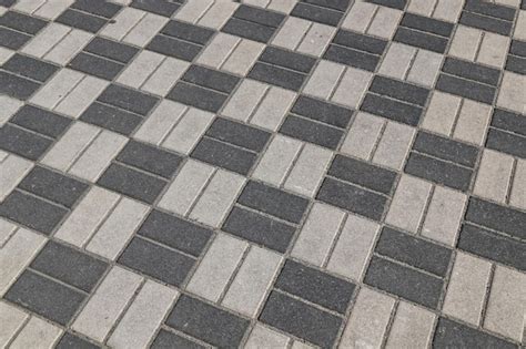 Premium Photo Black And Gray Paving Slabs On The Sidewalk In The City