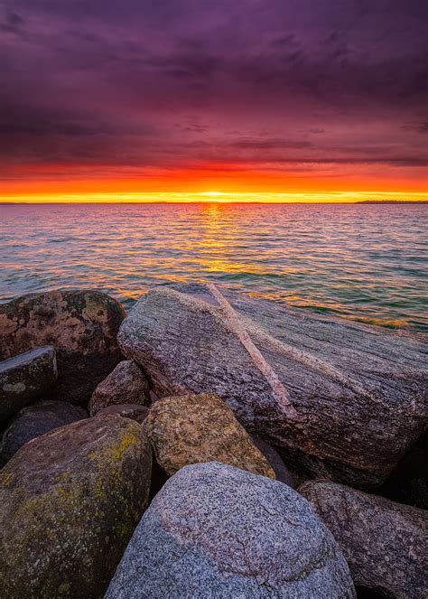 Pier Stones Sea Sunset Horizon Hd Wallpaper Peakpx