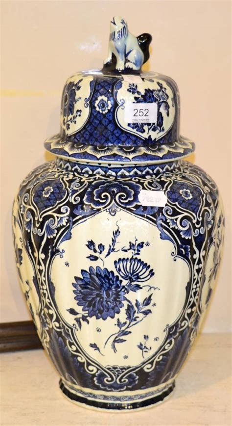 Lot 252 - A modern decorative blue and white vase and